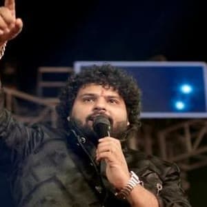 Pt. Govinda Sharma singing on stage